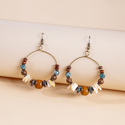 Primary supplied view of brown-bead antique-gold hoop earrings