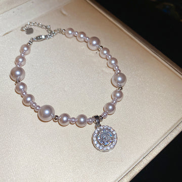 Silver Tone Pink Pearl Like Bracelet With Round Crystal Halo Charm