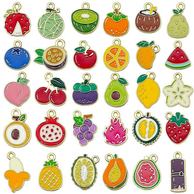 Colorful strawberry and cherry charms arranged on a light background