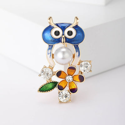 Blue Owl With Flower brooch shown from the front