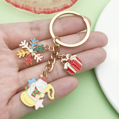 Image 1 showing a person holding two different key chains.