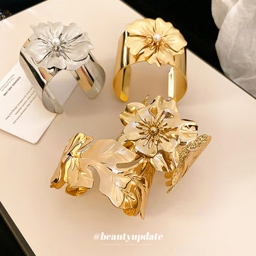 Two Mixed Gold Tone Wide Open Cuffs With Sculpted Flowers Or Leaves