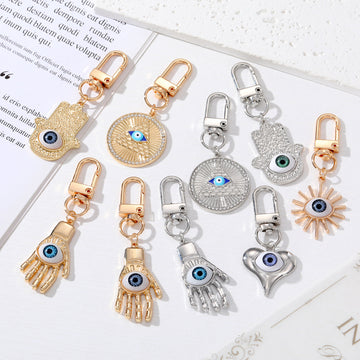Gold and Silver Tone Geometric Hamsa and Eye Clip Keychains