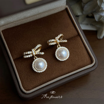 Gold Tone Clear Stone Bow And White Pearl Halo Drop Stud Earrings