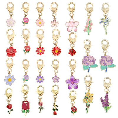 Image 5 showing a set of different flowers and leaves on gold key chains.