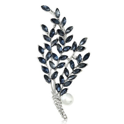 Front view of the long crystal leaf branch brooch showing a long leafy branch of marquise crystals with a crystal-wrappe
