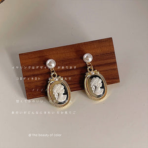 Gold Tone Pearl Top Black White Cameo Profile Medallion Drop Earrings
