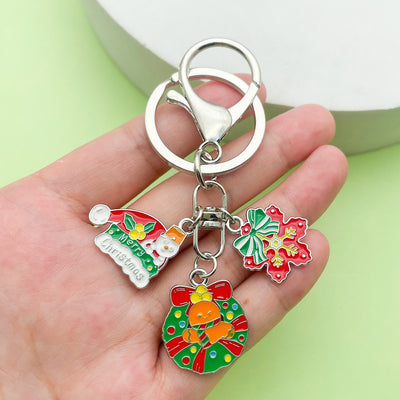 Image 1 showing a person holding two different key chains.