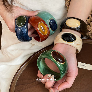 Acrylic Wide Bangle with Oval Gold-Framed Cabochon