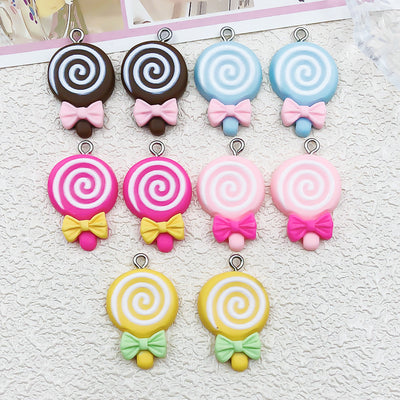 Multicolor ice cream charms arranged on a light background