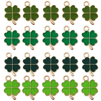 Colorful four-leaf clover charms arranged on a light background