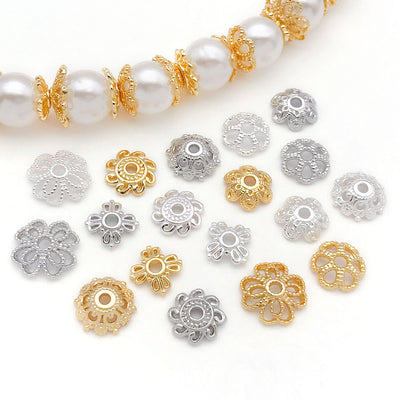 Front overview of six pattern metal bead caps in three finishes arranged by finish and size