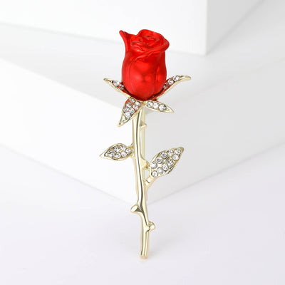 Front view of a vivid red rose on a long gold-tone stem with crystal leaves
