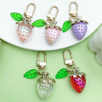 Image 1 showing three different colored strawberry shaped charms.