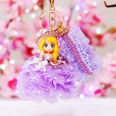 Main image 1 shows a supplied presentation of jeweled wedding gown doll keychains with visible attached key hardware.
