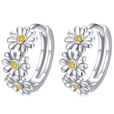 Silver daisy huggie hoop earrings alternate white studio pair shot