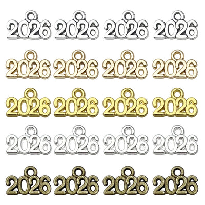 Gold-tone number charms arranged on a light background