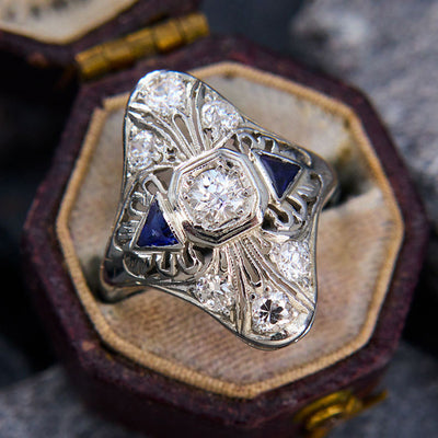 Same silver filigree blue triangle ring in open box