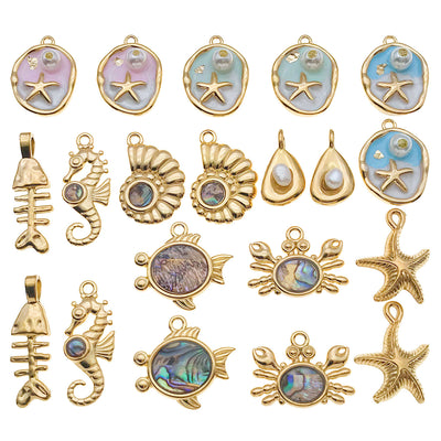 Gold-tone crab and starfish charms arranged on a light background