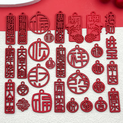 Red assorted shape charms arranged on a light background
