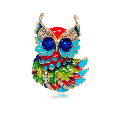 Front product view of an enamele broochi with colorful leaves and crystals