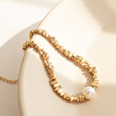 Neckline view of irregular mineral and imitation pearl necklaces in main image 1.