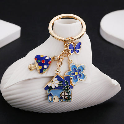 Main display of blue pink and green butterfly mushroom house keychains
