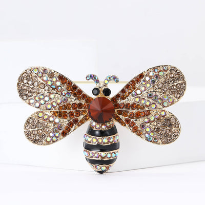 Front view showing the gold tone bee brooch covered with champagne crystal wings