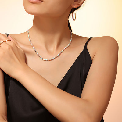 Model wearing pastel natural stone and silver cube bead choker necklace