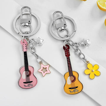Guitar Shaped Charm Keychain With Star And Flower Pendants