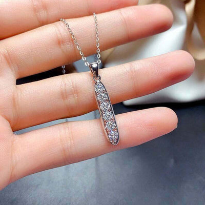 Silver long bar five clear CZ pendant necklace held on hand