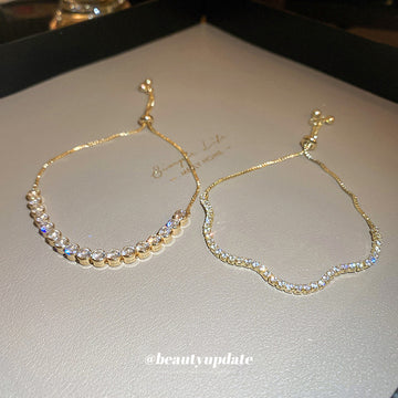 Gold Tone Adjustable Slider Bracelet In Round Or Wavy Crystal Rows