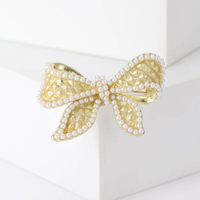 Gold Tone Bow brooch front view on a white background
