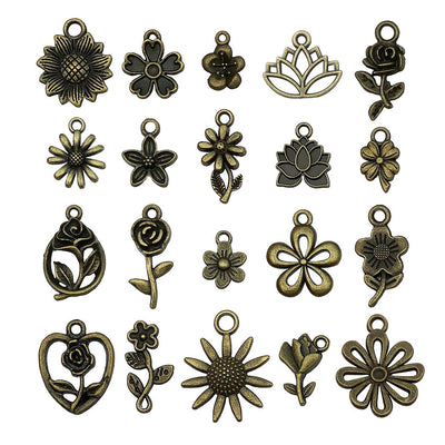 Gold-tone sunflower charms arranged on a light background