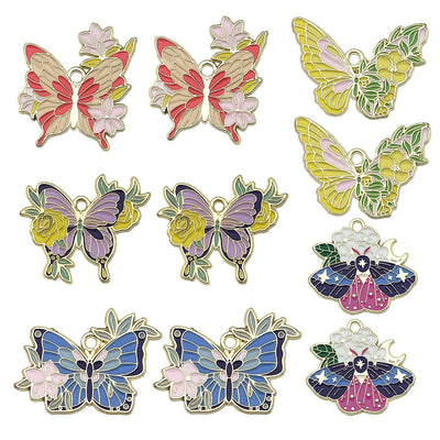 Gold-tone flower and butterfly charms arranged on a light background