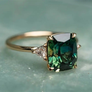 Cushion Three-Stone Ring In Pink, Blue, Red, And Green