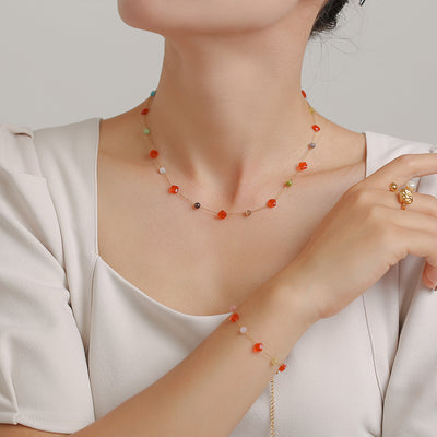 Orange multicolor stone station necklace and bracelet worn