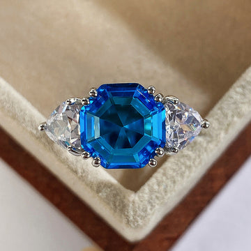 Silver Tone Octagonal Blue Stone Ring With Clear Side Stones