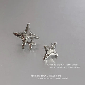 Silver Asymmetric Star Stud Earrings Cat Eye Accent Pair