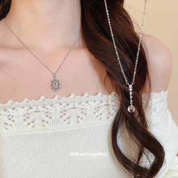 Silver Tone Oval Crystal Halo Pendant Necklace with Detailed Finish