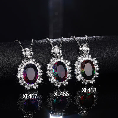 Product view of silver tone oval gradient crystal sunburst pendant necklaces