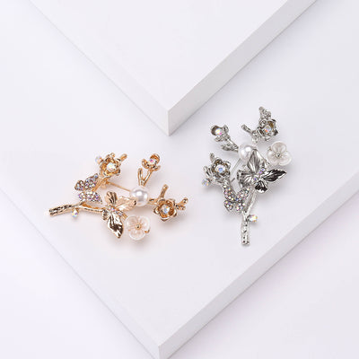 Crystal Plum Blossom Branch Brooch In Gold Or Silver Tone front view on a light background