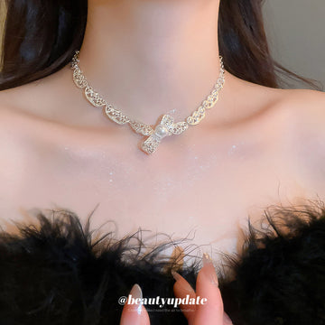 Silver Tone Bow Necklace with Textured Ribbon Links