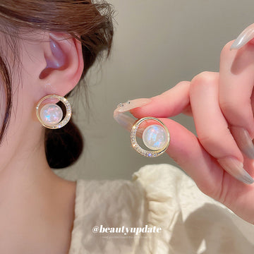 Round Opalescent Crystal Stud Earrings With Polished Metal Tone Details
