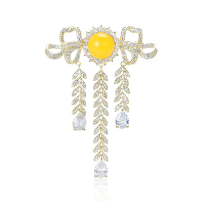 Gold bow brooch yellow center three crystal tassels front