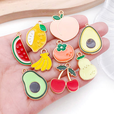 Colorful pineapple and strawberry charms shown in a close-up product view