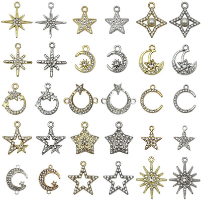 Metallic moon and star charms arranged on a light background