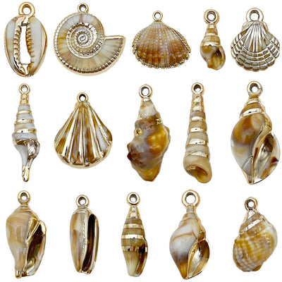 Gold-tone shell charms arranged on a light background