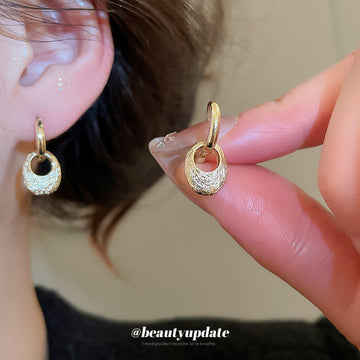 Pair of Metal Tone Gold Tone Sculpted Oval Drop Hoop Earrings