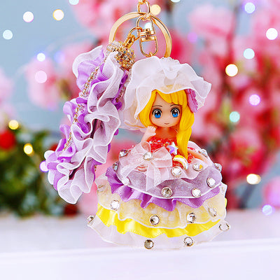 Main image 1 shows a supplied presentation of jeweled bonnet princess doll keychains with visible attached key hardware.
